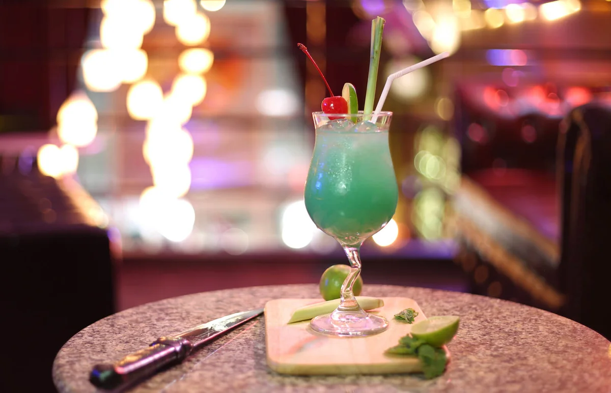 Cocktail Served On Table In Illuminated Restaurant