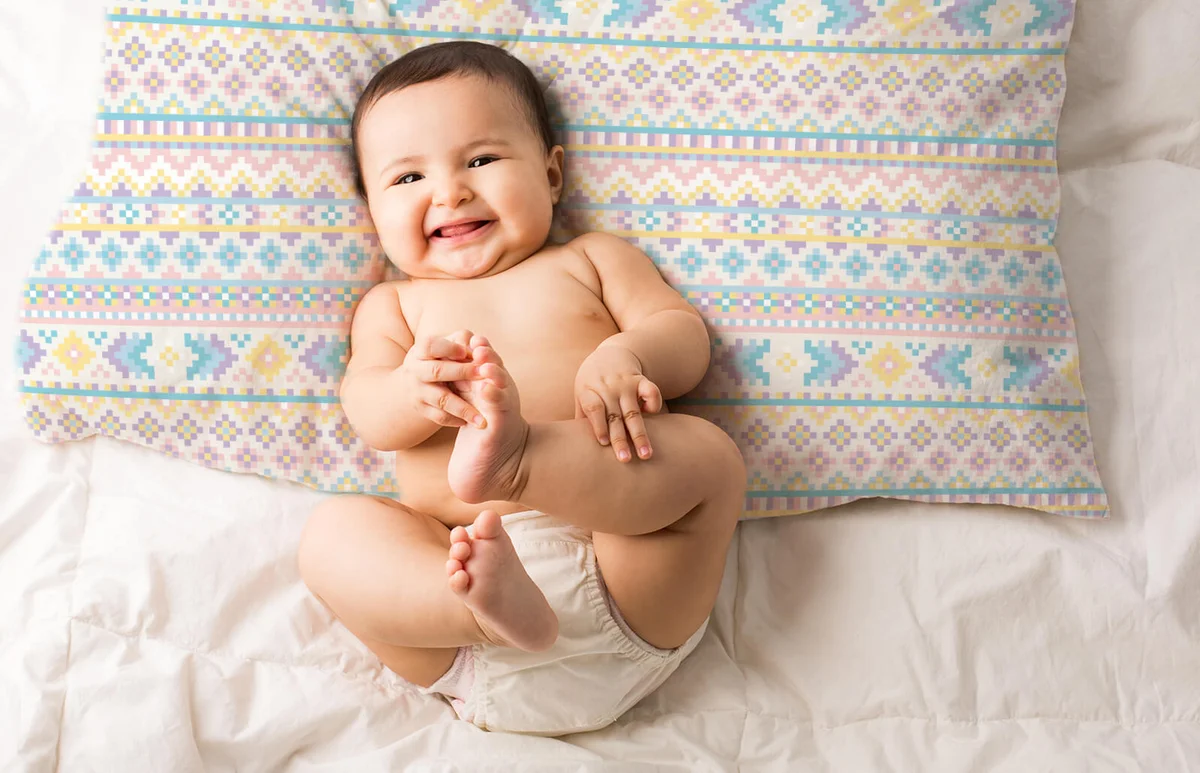 Cute baby girl on bed