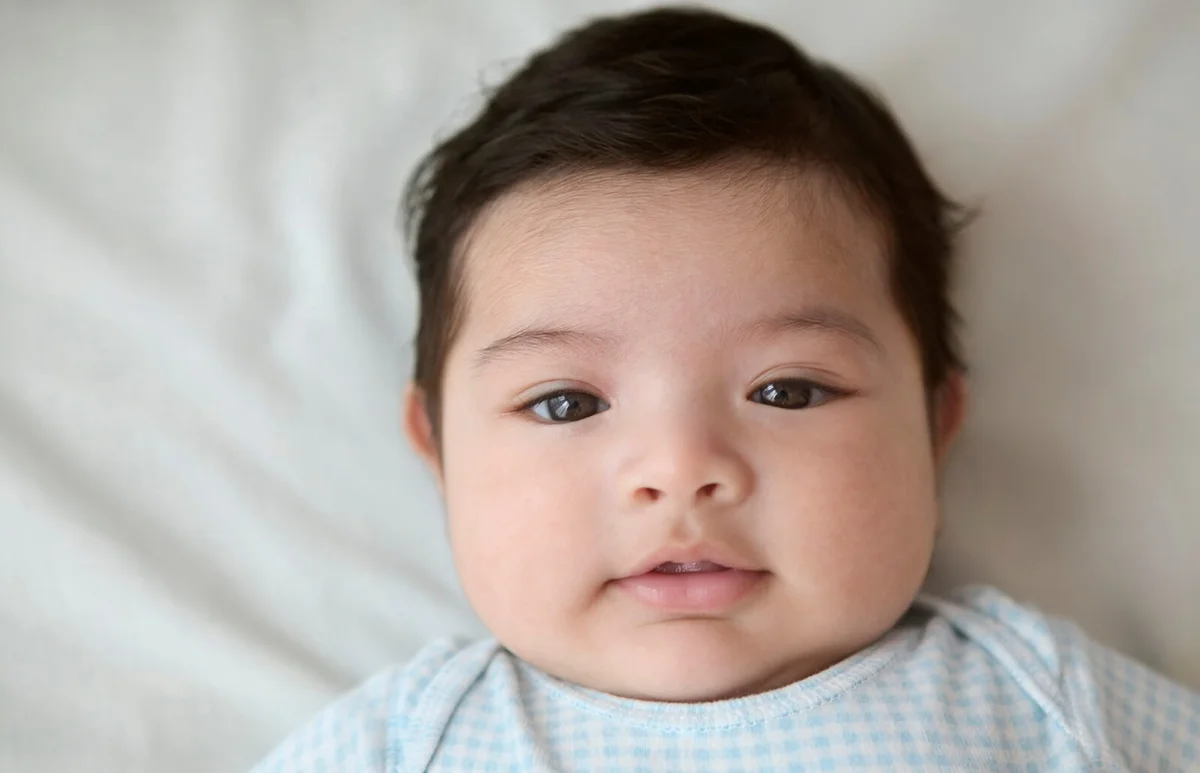 Portrait of a baby boy lying on his back
