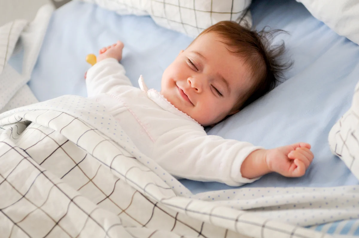 Baby Sleeping On Bed At Home
