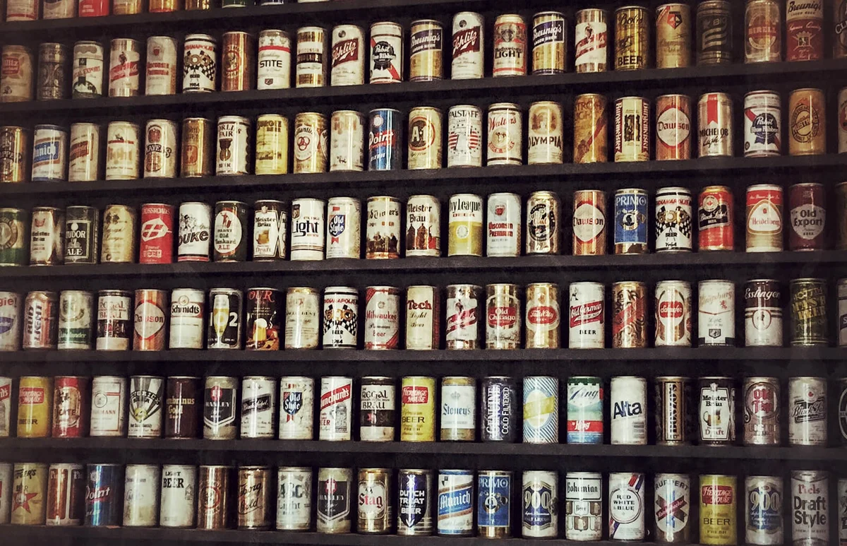 Beer Cans Arranged In Shelves At Store