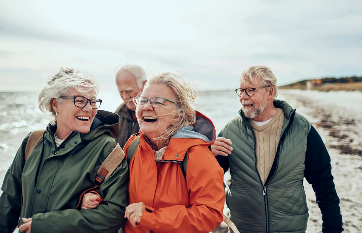 Seniors walking on the beach