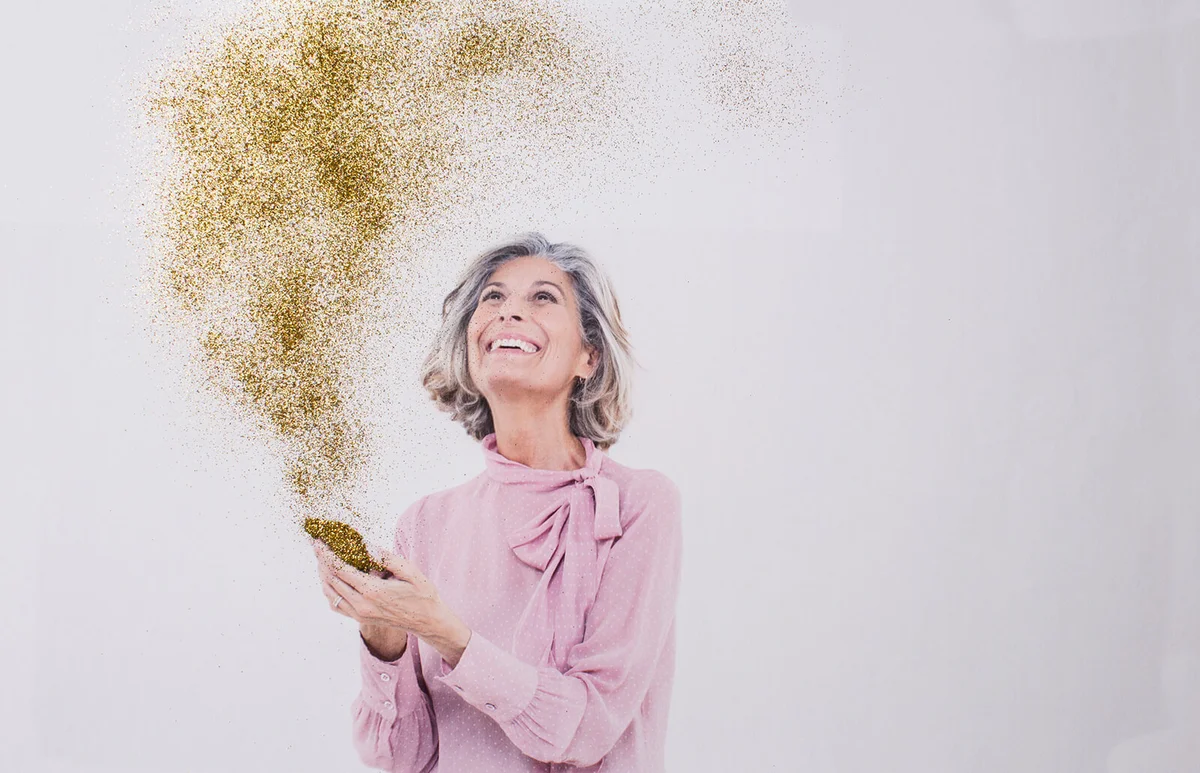 Mature woman looking at gold dust