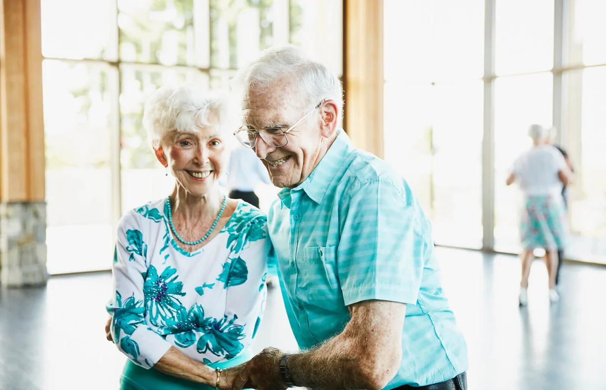 senior couple dancing together in ballroom
