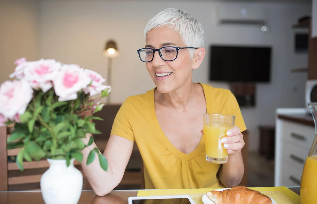 Woman having breakfast at home