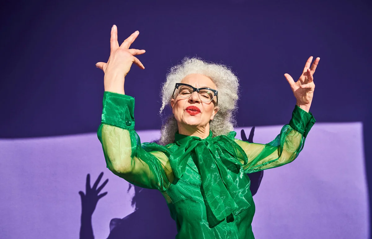 Colorful studio portrait of a senior woman