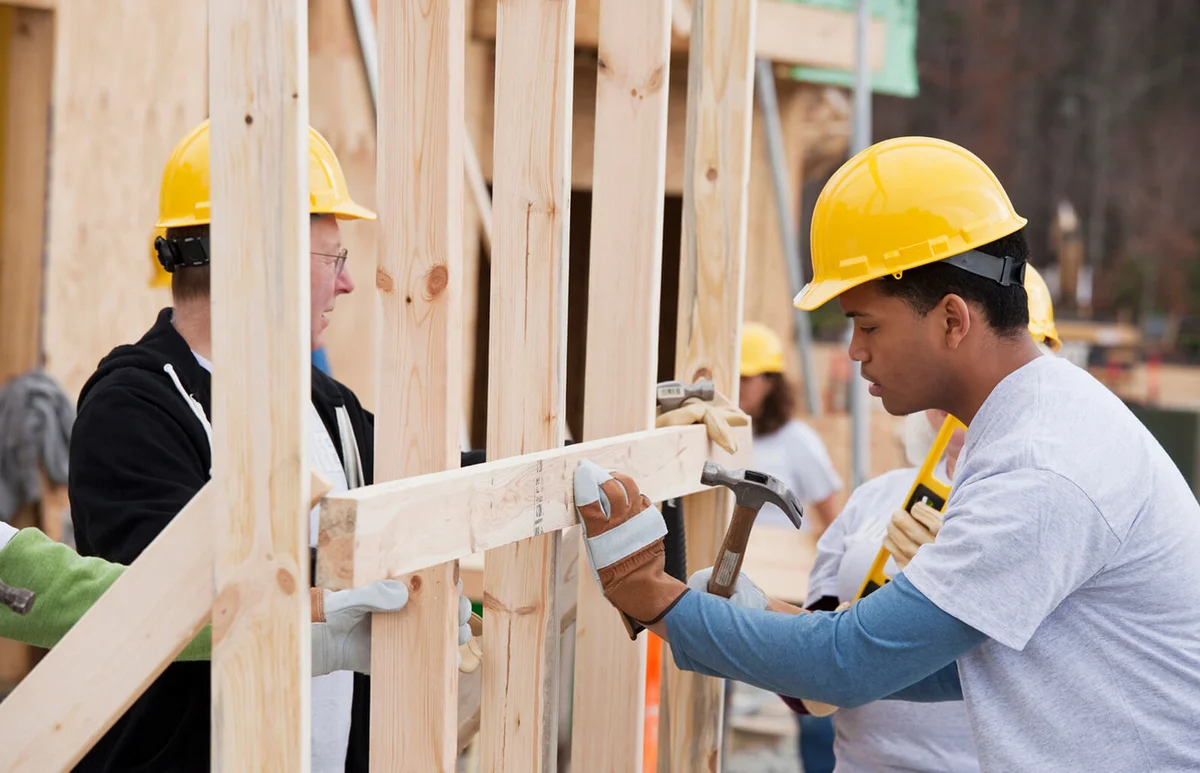 Volunteers working on construction site