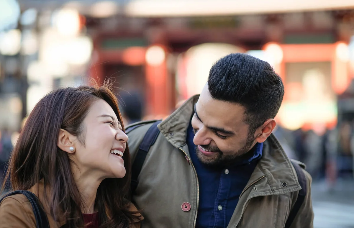 Woman and man talking on street