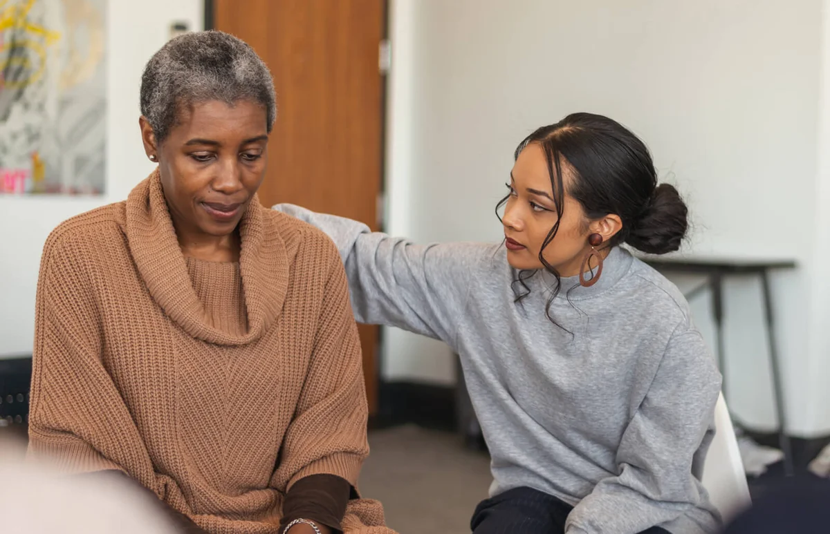 Young woman shows support in therapy session