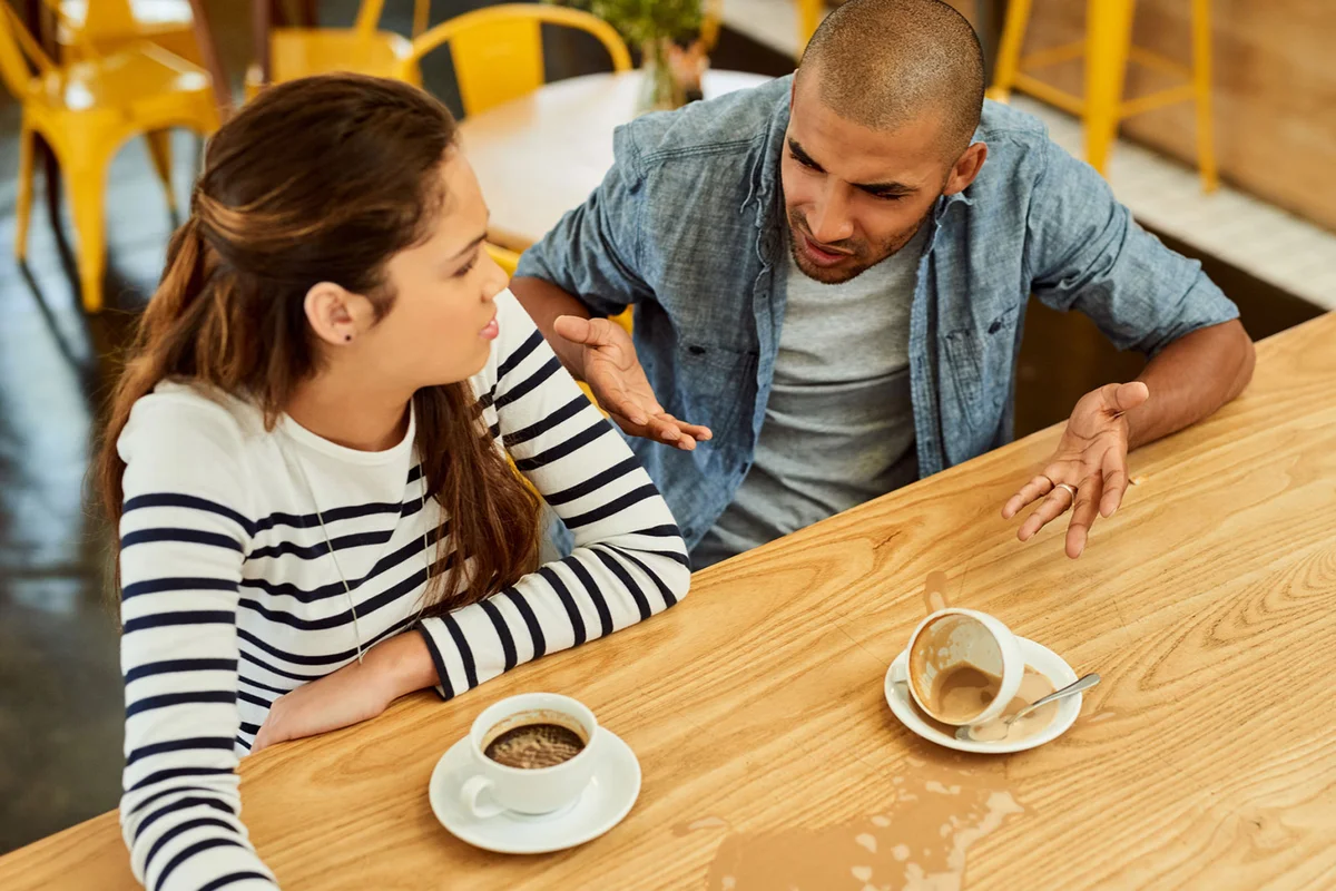 Couple arguing in restaurant