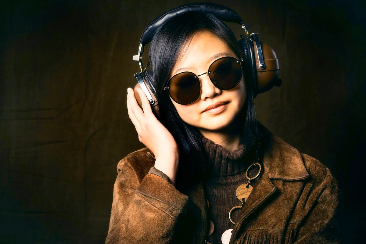 Woman wearing vintage clothing and headphones