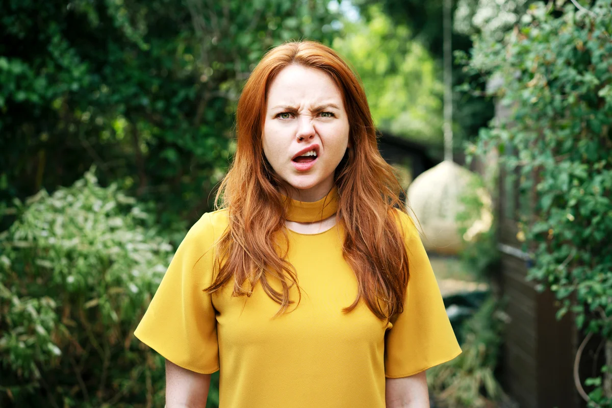 Woman pulling face