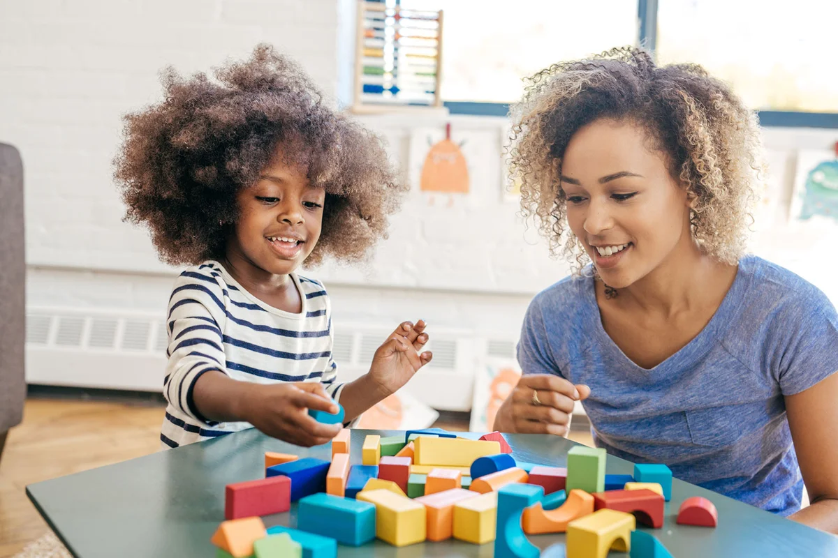 Gemini child playing with blocks