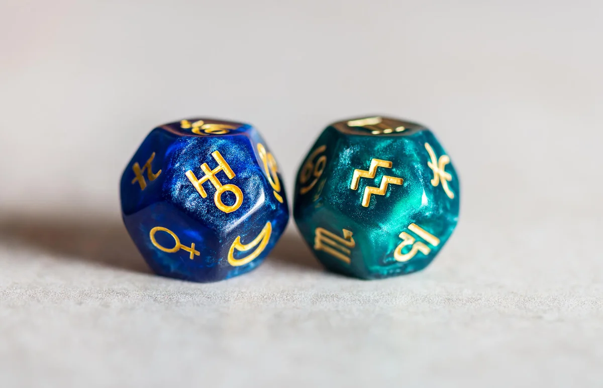 Astrology Dice with zodiac symbol of Aquarius and its ruling planet Uranus