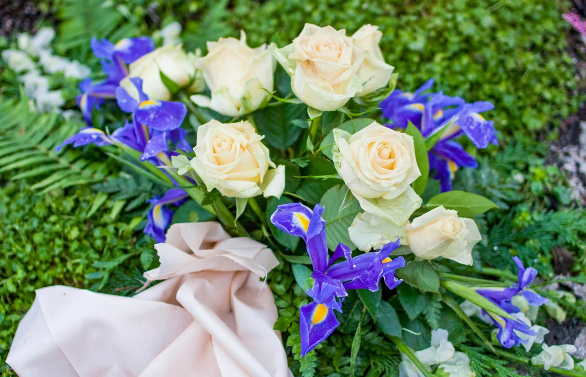 Silk flowers on a gravestone