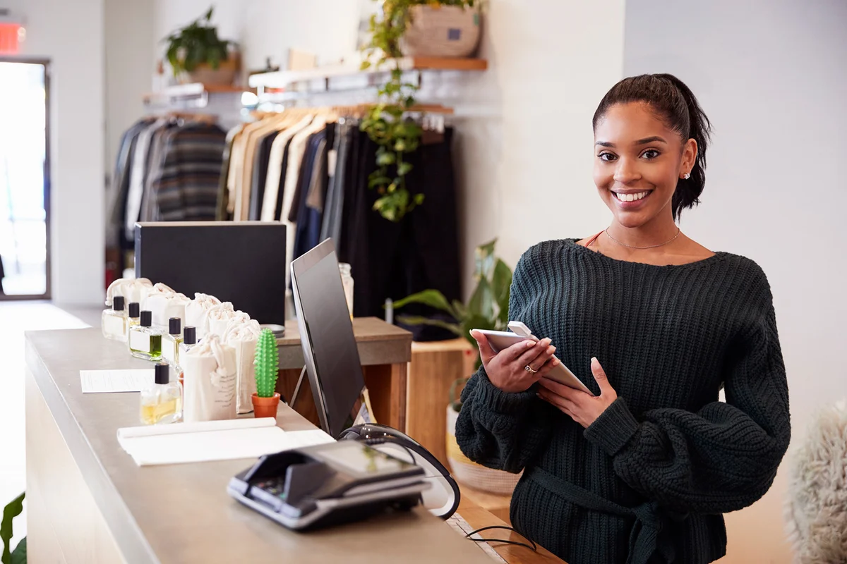 Saleswoman smiling from the counter