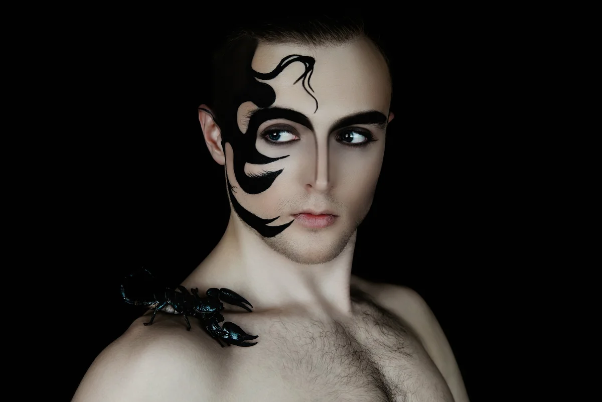 Man with dramatic face tattoo