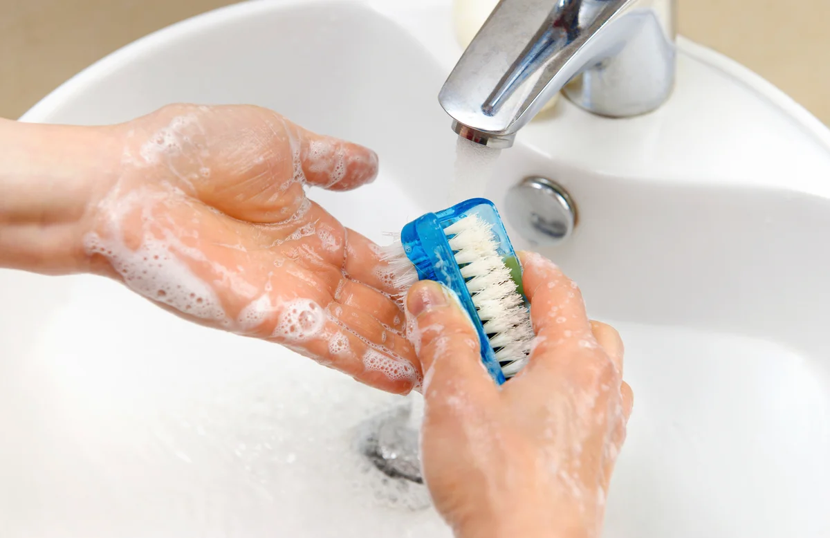 Person scrubbing hands