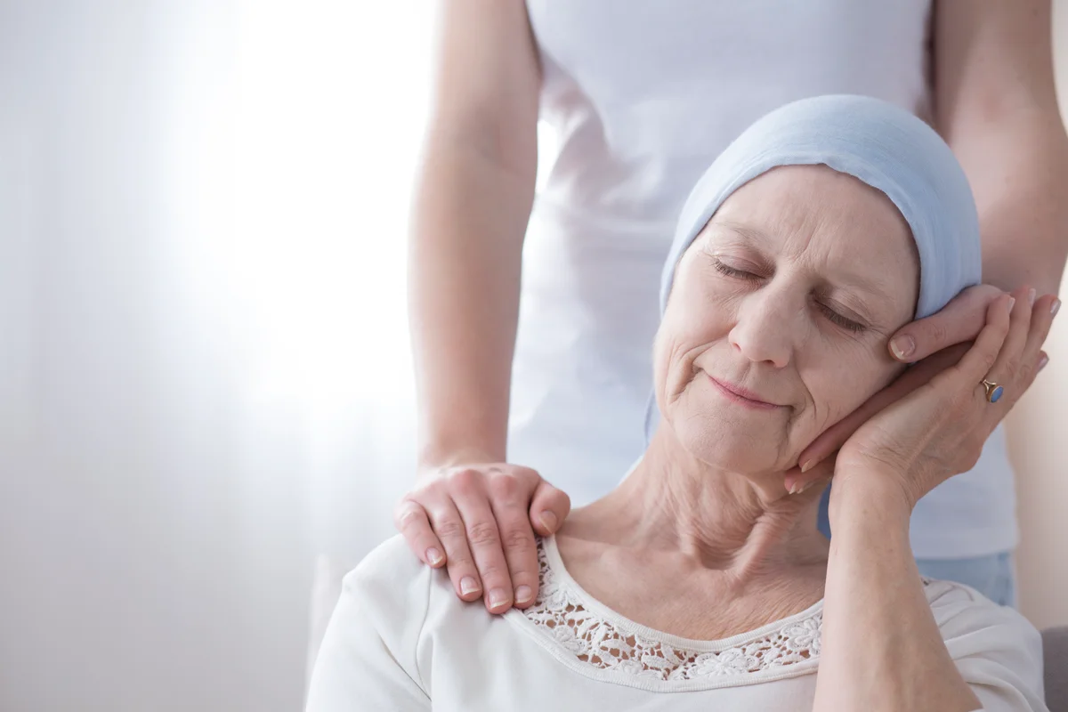 Loved one comforting hospice family member