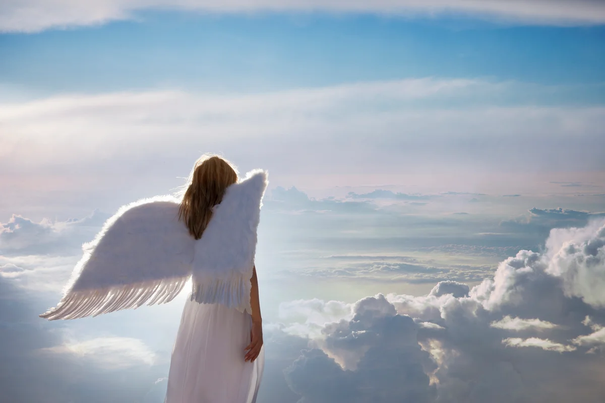 Angel standing on clouds