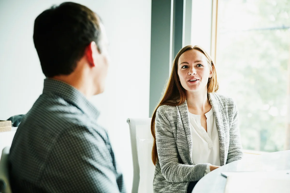 Business woman and man talking