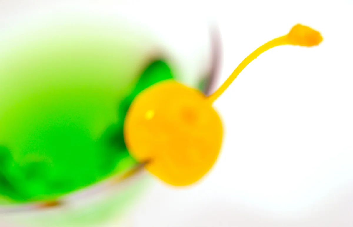 The martini glass with yellow cherry