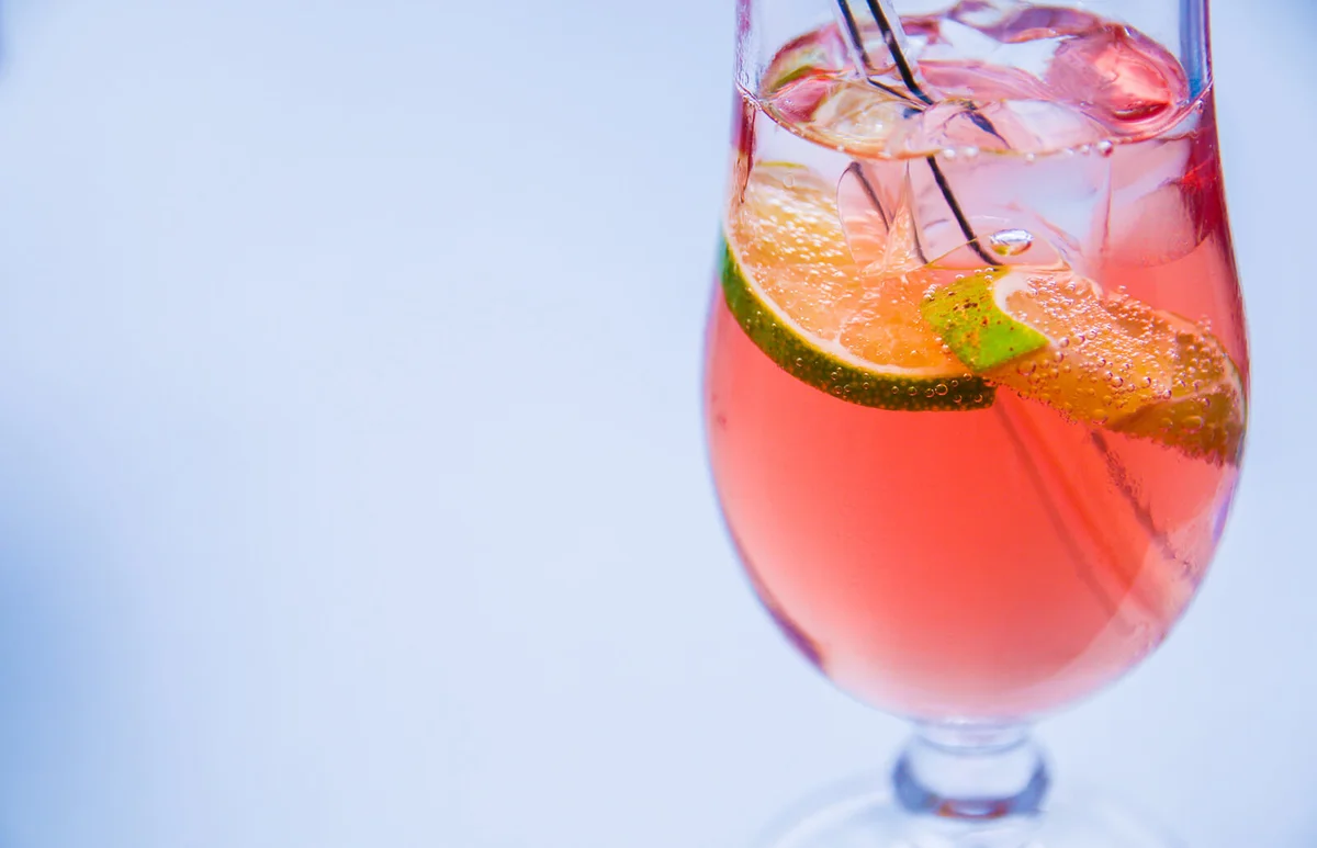 Close-Up Of Wineglass Against White Background