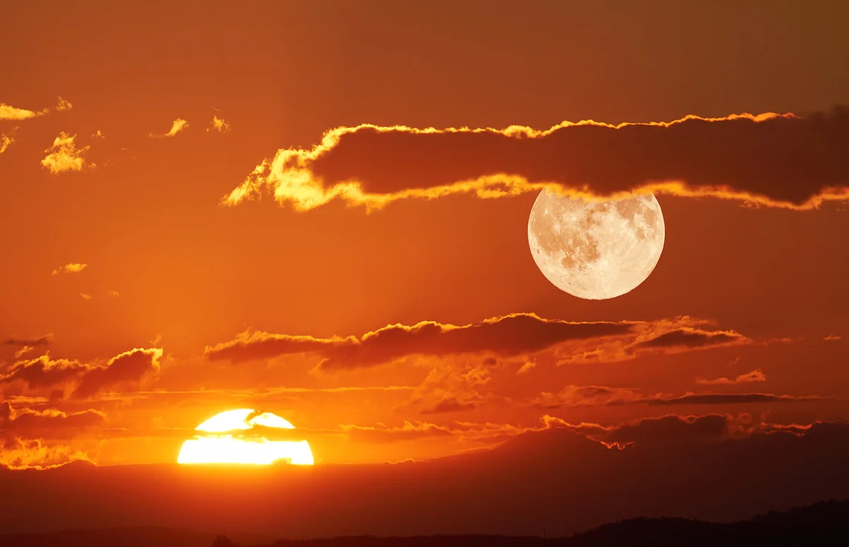 Scenic View Of Full Moon During Sunset
