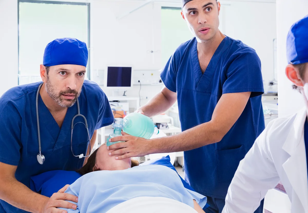 Doctors reviving patient