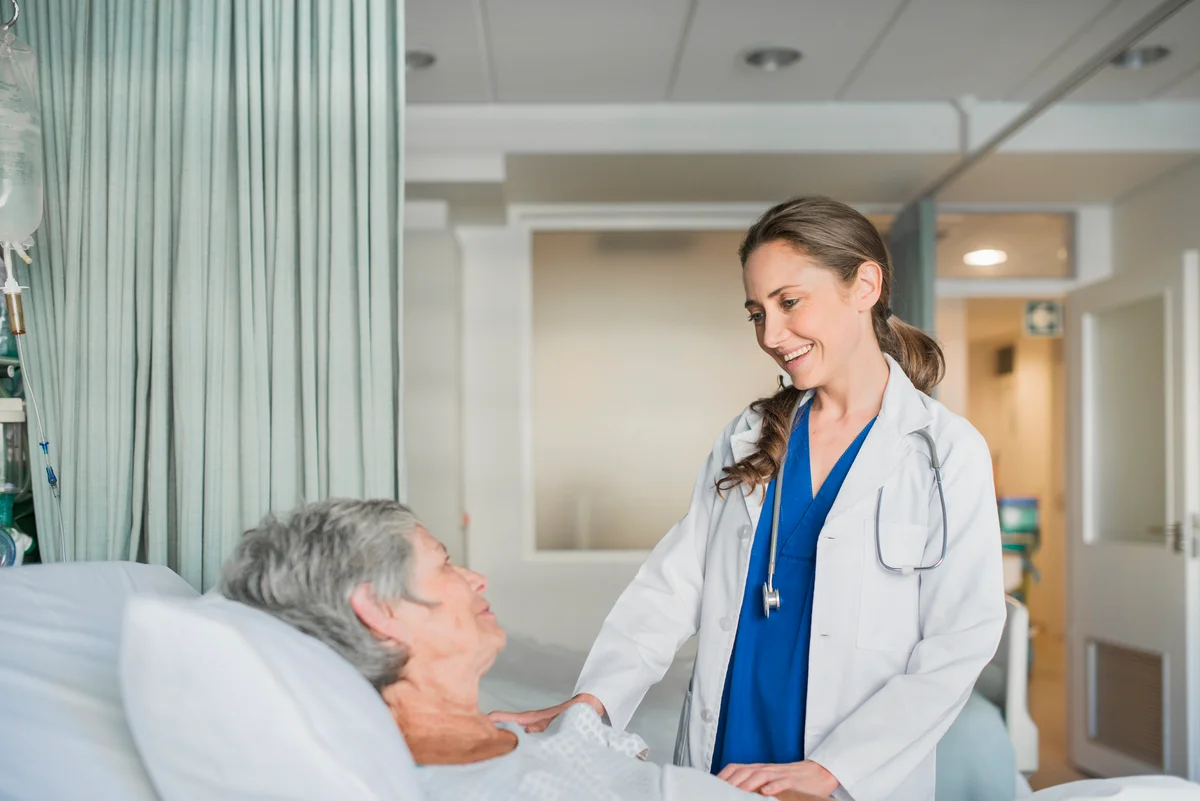 Doctor consulting with patient in hospital