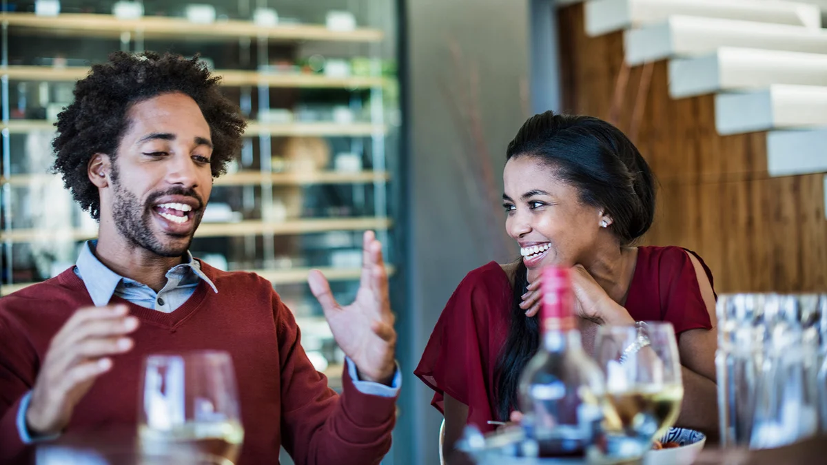 Man telling a story at a dinner party