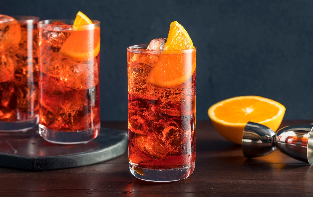Refreshing Cold Americano Cocktail with an Orange Garnish