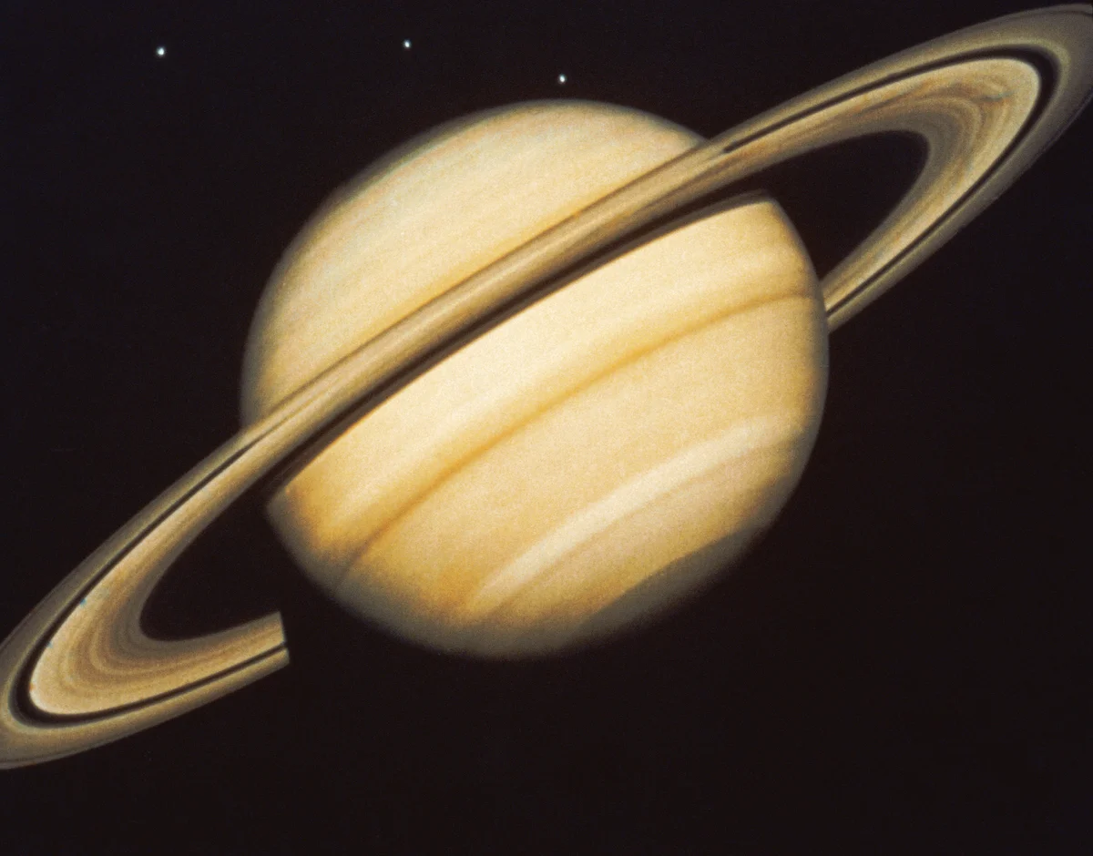 Saturn and three moons