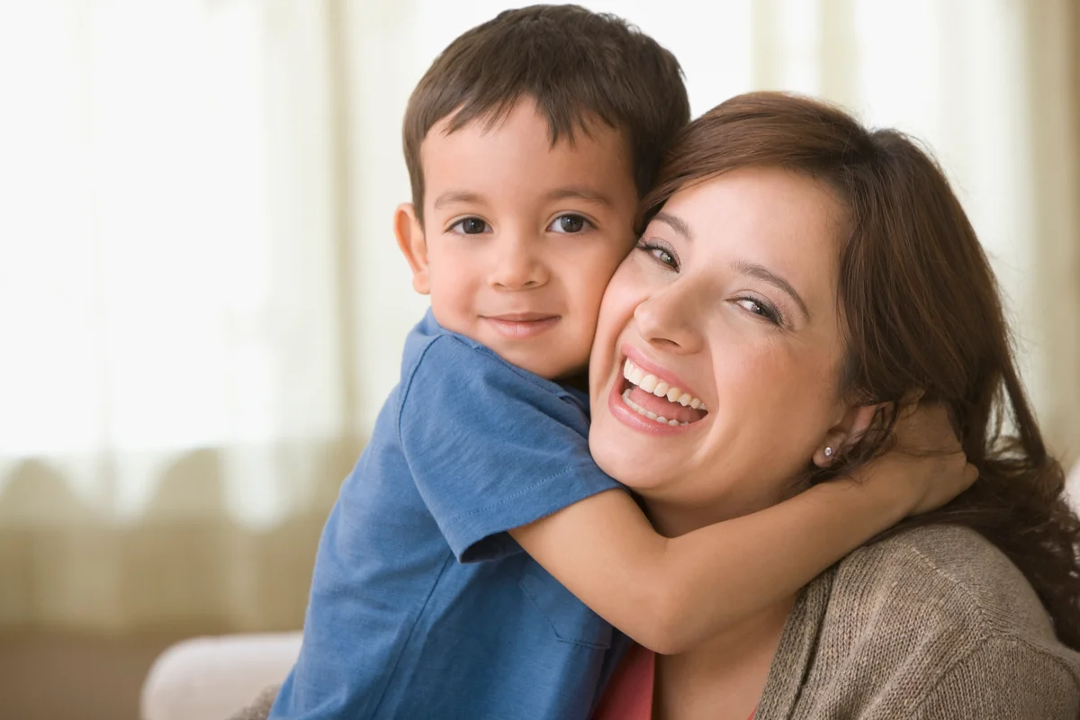 Mom and son hugging