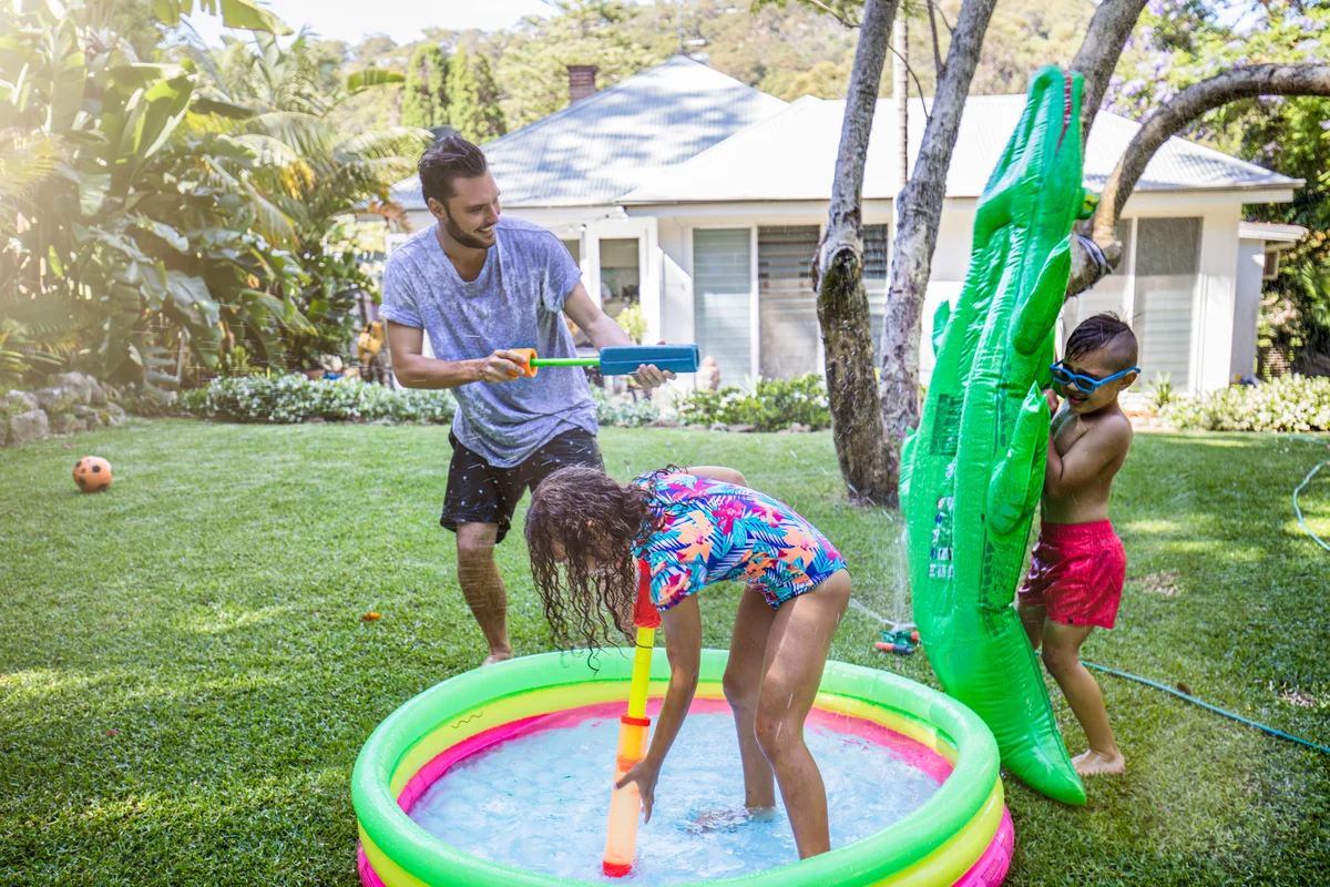 Family having a water fight
