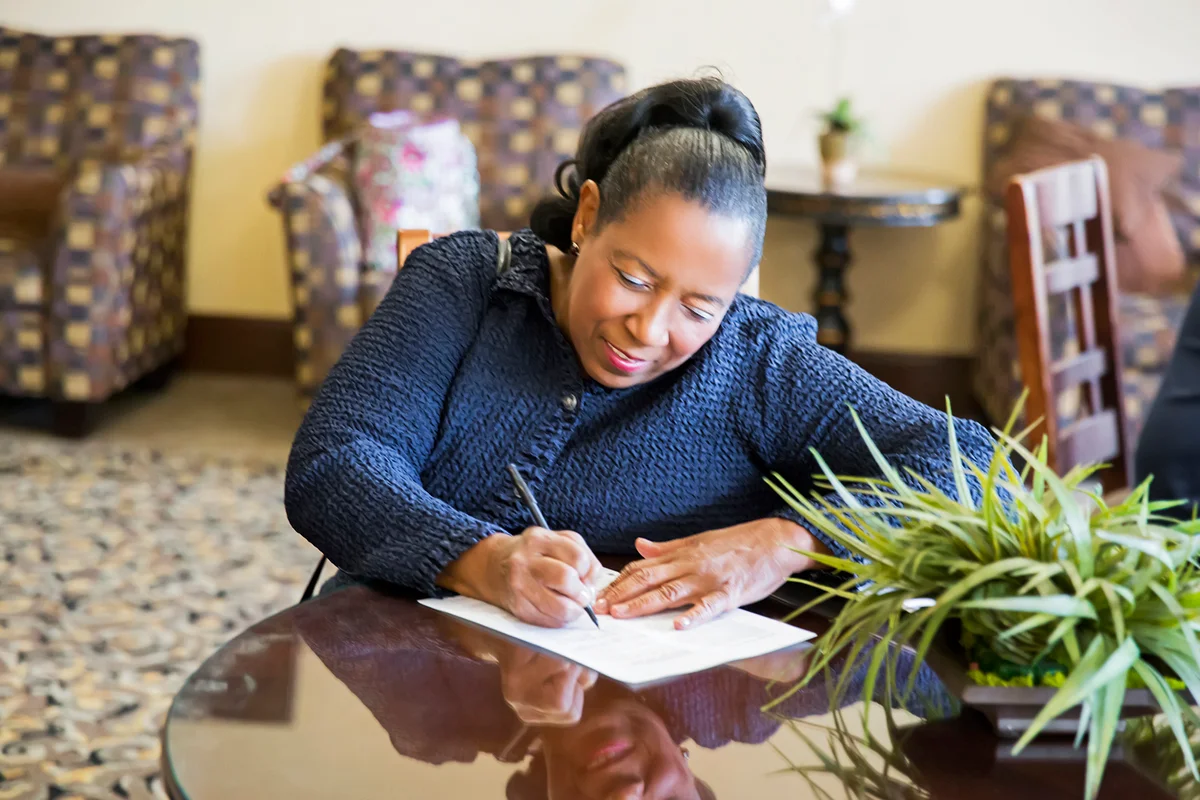 Woman filling out paperwork