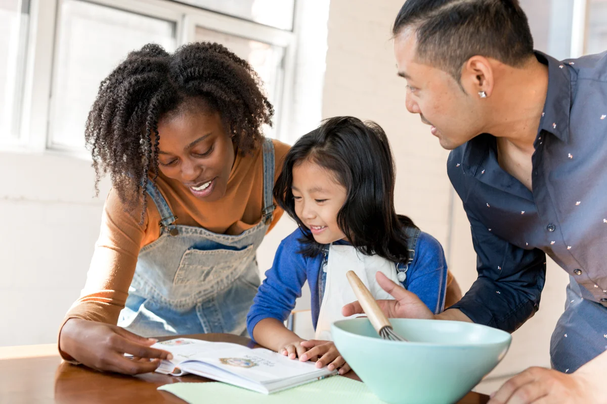 Stepmom helping child with recipe