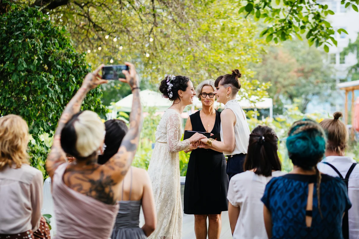 Lesbian couple exchanging wedding vows