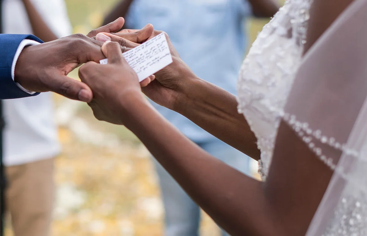 Newlywed couple Exchanging Rings at Wedding Ceremony