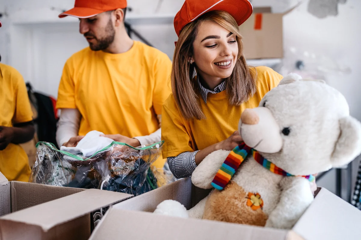 Volunteer accepting stuffed animal donation