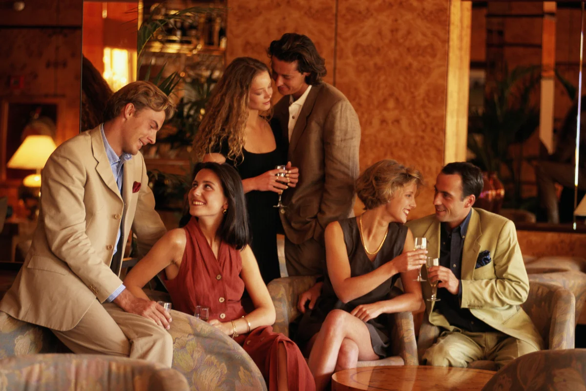 Three couples at cocktail party