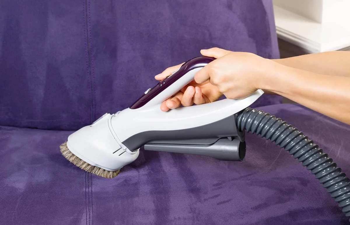 Cleaning Leather Sofa with Vacuum Brush