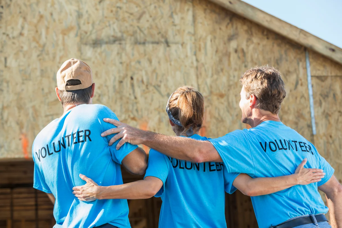 Volunteers building a house