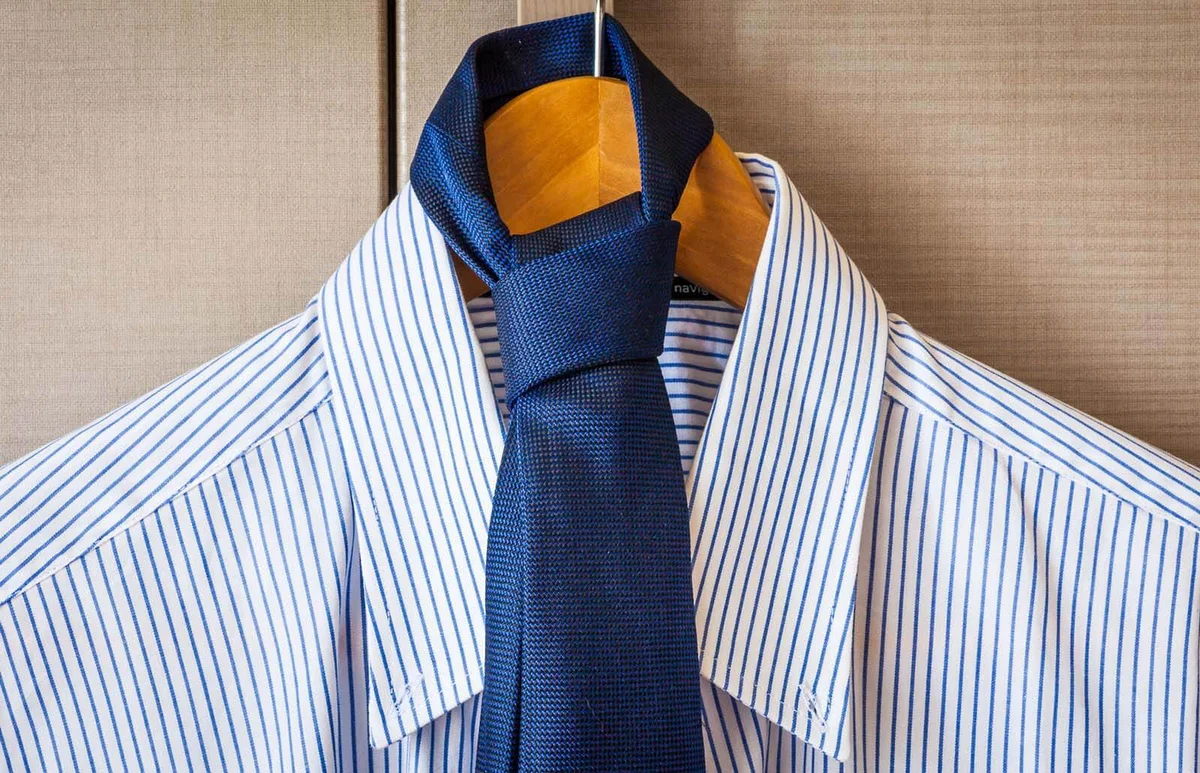 Necktie Hanging On Coathanger By Window