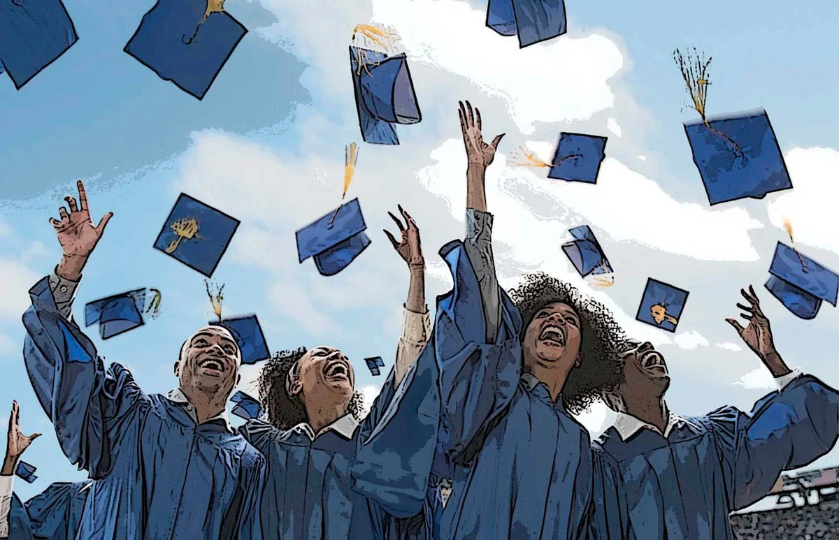 Students throwing caps at graduation