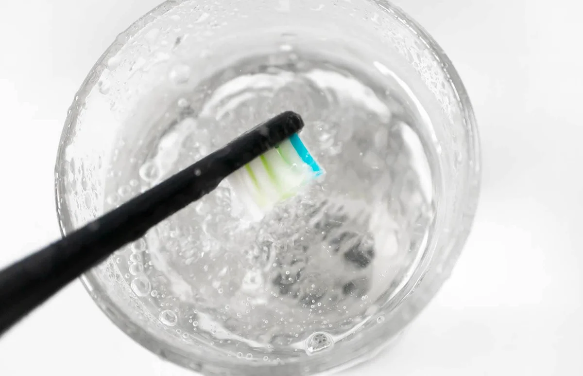 toothbrush and water on glass