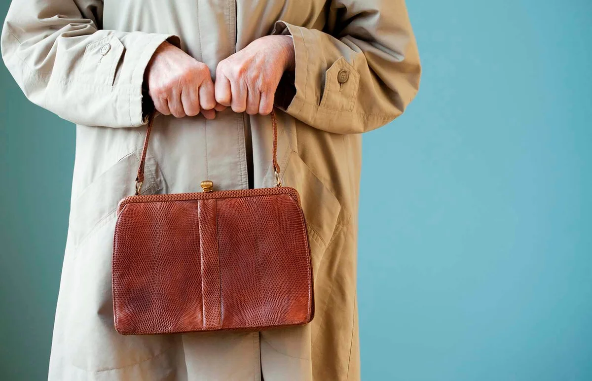 Senior woman holding handbag