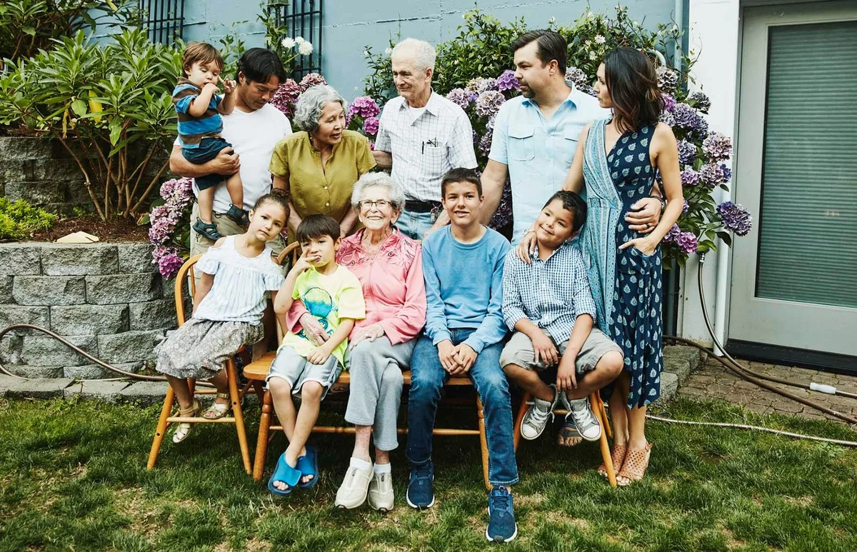 Multigenerational family preparing for family portrait