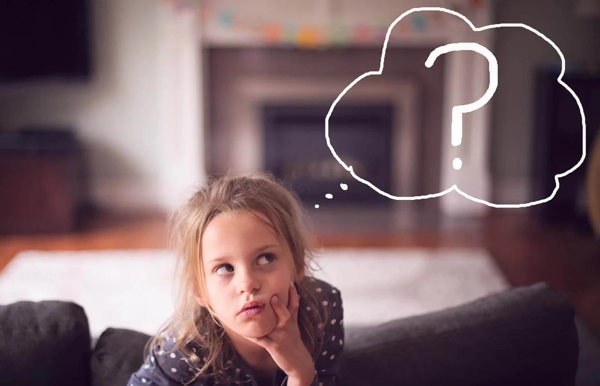 Girl With Thoughtful Expression and Question Mark