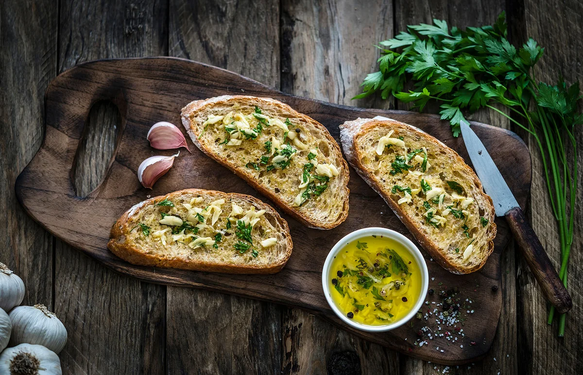 garlic bread on rustic wooden table